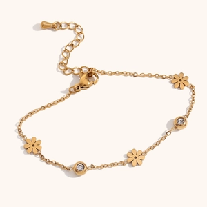 Elegant 18K gold-plated stainless steel floral bracelet with black and white crystals