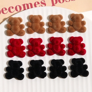 Detail of velvet flocked bear charms in brown, red, and black for DIY craft earrings