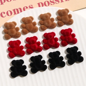 Close-up of velvet flocked bear resin patches for DIY jewelry and hair accessories