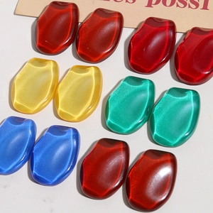 Close-up of colorful irregular resin cabochons for DIY jewelry making and crafts