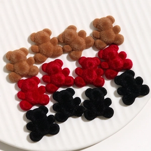 Detailed view of plush velvet bear DIY charms in brown, red, and black for handmade jewelry