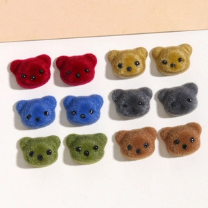 Detail of colorful velvet bear resin patches for DIY earrings and phone cases