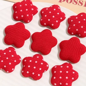 Red fabric star patches with polka dots for DIY hair accessories and craft projects