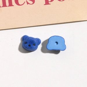 Front and back detail of blue flocked bear charms for jewelry and DIY crafts