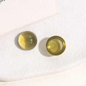 Detail of 14mm translucent amber jelly round resin charm for DIY earring and phone case
