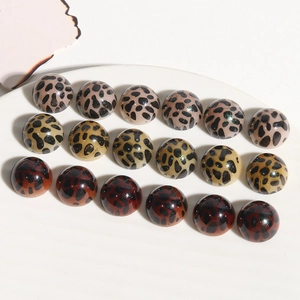 Close-up of leopard print acrylic cabochons for DIY jewelry and accessory making