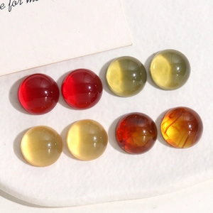 Macro view of 14mm translucent jelly amber colored round resin beads for DIY jewelry