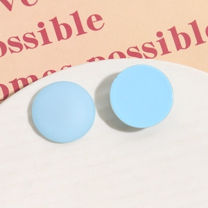 Macro view of 26mm matte sky blue resin round charms for DIY hair clips and jewelry