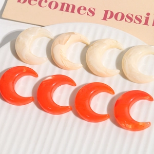 Clear moon shaped resin charms in creamy marble and orange for DIY jewelry making