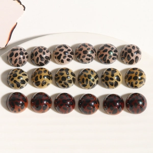 Polished leopard print acrylic cabochons in pink, yellow and brown for DIY jewelry making