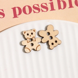 Close-up of bear and gingerbread man wooden buttons with 2-hole DIY craft details