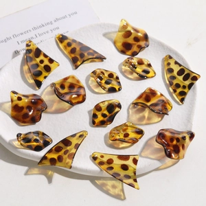 Leopard print resin leaf charms for DIY earring and jewelry making on white tray