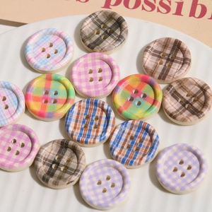 Close-up of mixed colors checkerboard pattern wood round buttons for DIY crafts