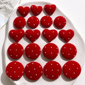 Red velvet heart and round craft patches with silver glitter polka dots on white tray