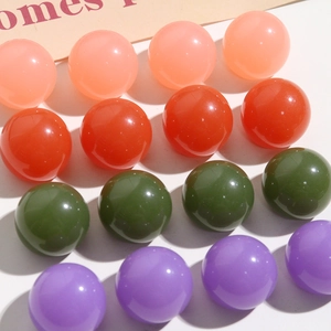 Close-up of colorful round resin beads for DIY hairpins and jewelry accessories