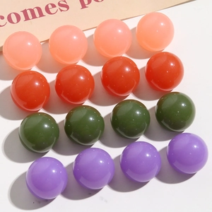 Macro view of colorful 4x4 resin sphere beads for DIY hair clips and jewelry making