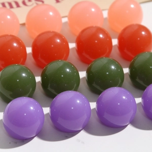 Macro view of colorful resin dome beads for DIY hairpins and jewelry making