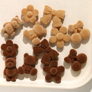 Detailed view of DIY velvet hair clip accessories in bear, flower, and bow shapes