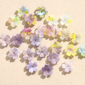 Detail of gradient resin cherry blossom beads with center holes for DIY jewelry making