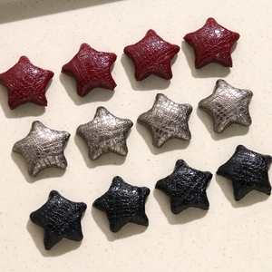 Set van 12 stervormige patches van reliëf kunstleer in bordeaux, zilver en zwart