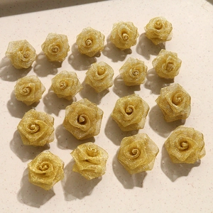 Detailed view of handmade golden mesh rose accessories for elegant DIY jewelry crafts