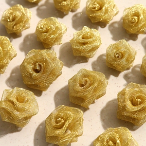 Detailed view of handmade golden mesh woven rose flower accessories for DIY jewelry making