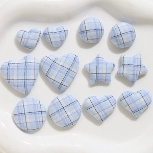 Light blue plaid fabric buttons in heart, star, and round shapes for DIY sewing crafts