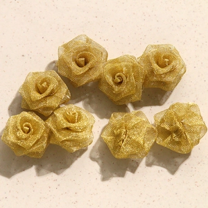Detail of 7 golden wire woven camellia charms for elegant DIY jewelry earring making