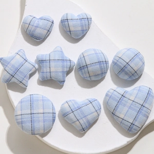 Blue plaid fabric covered buttons in star, heart and round shapes for DIY sewing