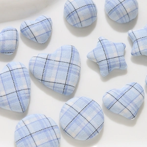 Light blue checkered fabric buttons in heart, star, and round shapes for DIY apparel