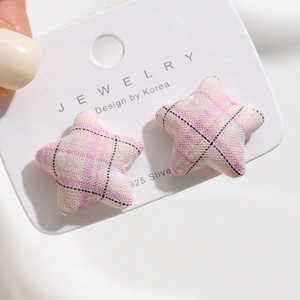 Pink checkered fabric star earrings with 925 silver studs on white display card