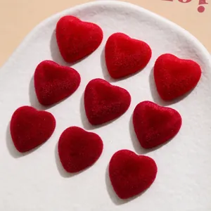 Macro detail of red velvet heart-shaped 3D resin patches for DIY jewelry and accessories