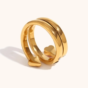 Detail of 18K gold plated triple-layer open ring with zirconia hearts and arrow design
