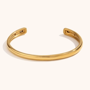 Polished 18K gold plated stainless steel open cuff bracelet with minimalist smooth finish