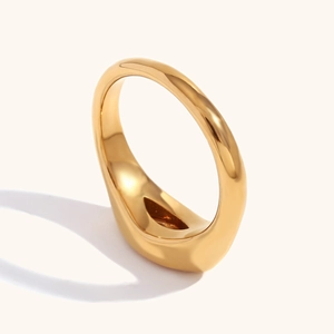 Detailed view of polished 18K gold plated stainless steel signet ring with thick band