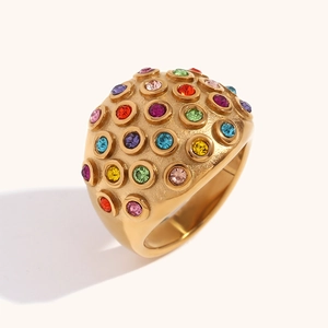 Polished 18K gold-plated dome ring with colorful round zircon stones on a beige background