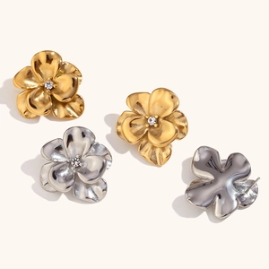 Double-layer flower stud earrings in 18K gold and silver with sparkling center crystals
