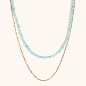 Detail of double-layer necklace with light blue amazonite beads and 18K gold-plated chain