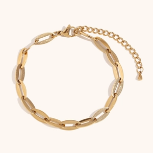 Detail of 14K gold-plated anklet showing lobster clasp and textured oval chain links