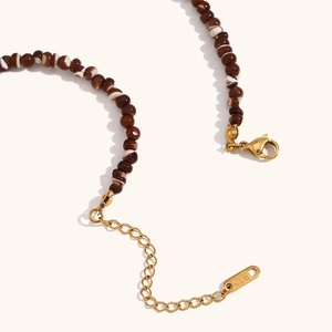 Vintage 18K gold plated necklace featuring petal pendant and natural stone beads