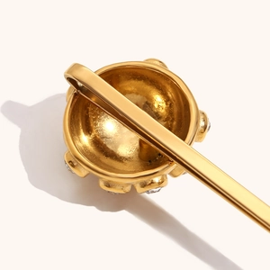 Polished 18K gold plated hair clip with sparkling white zircons and ball-shaped metal design