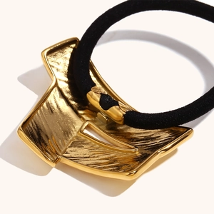 Elegant gold-plated stainless steel hair tie with a textured geometric origami-style charm