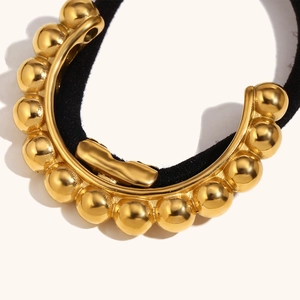 18K gold plated stainless steel hair tie with a decorative beaded metal sphere design