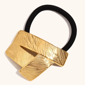 18K gold plated geometric hair tie with black elastic band and textured metal charm