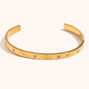 18K gold plated stainless steel open bangle with sea shell and starfish relief