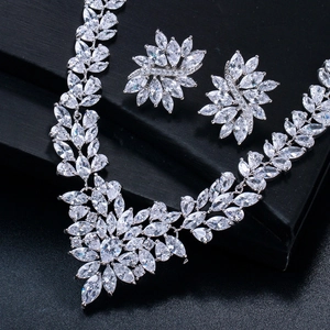 Detailed view of silver zircon leaf necklace and earrings set for evening events