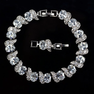 Macro shot of silver bracelet showing large oval zircon stones and intricate micro-pave setting