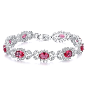 Bracelet élégant en argent avec rubis rouges ovales et motifs floraux en zircons blancs