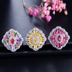Detailed view of floral rings with vibrant multi-color, yellow, and pink zirconia stones