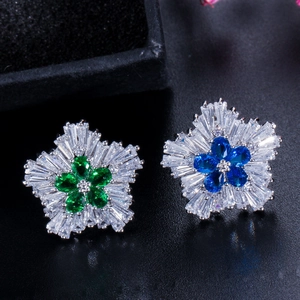 Snowflake zircon stud earrings with blue and green pear-cut center stones in silver finish
